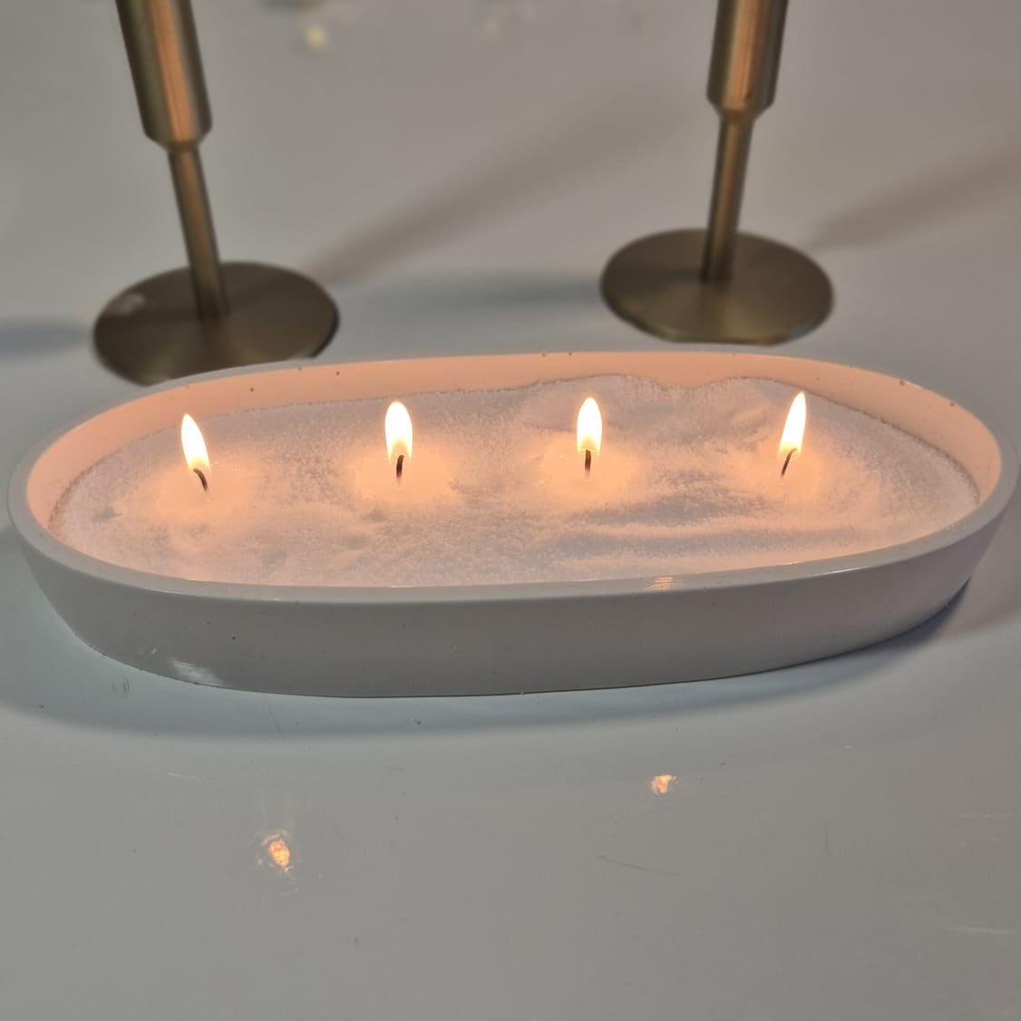 Container with sand wax and 4 wicks